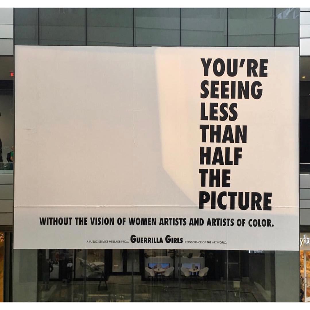 Art with white background and bold typeface drawn on the farthest end of the canvass that says "You’re seeing less than half the picture without the vision of women artists and artists of color."